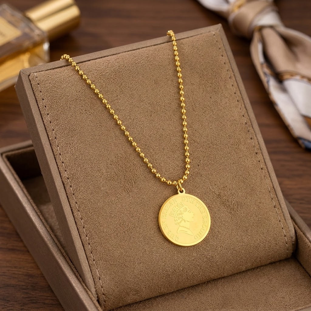 Gold coin charm pendant necklace with round medallion and beaded chain in gift box