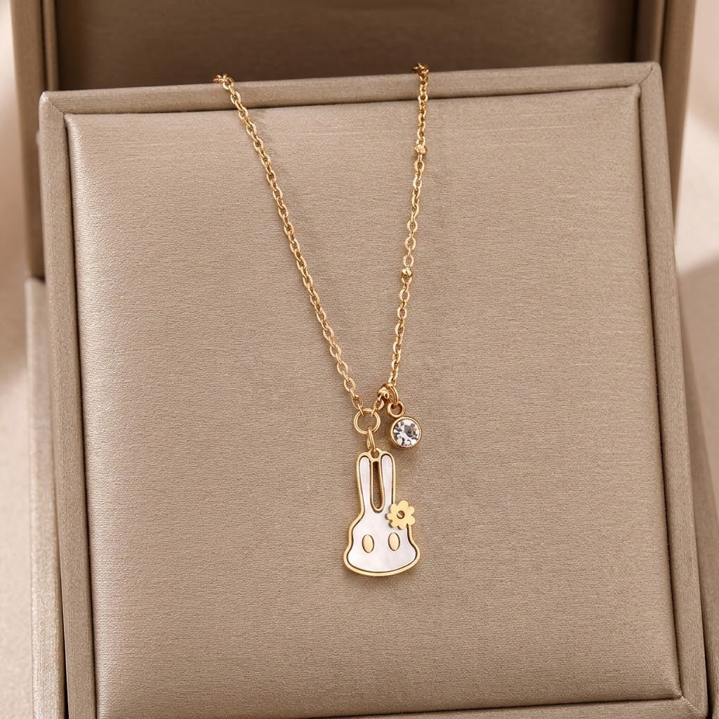 Gold-tone bunny charm pendant necklace displayed in gift box