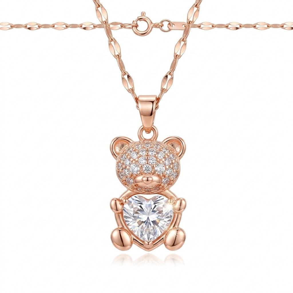 Rose-gold teddy bear pendant necklace with large heart crystal centerpiece