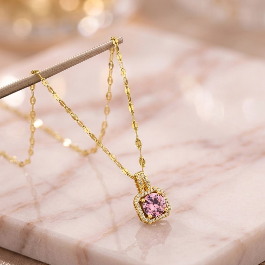 Gold pendant necklace with pink halo gemstone and link chain