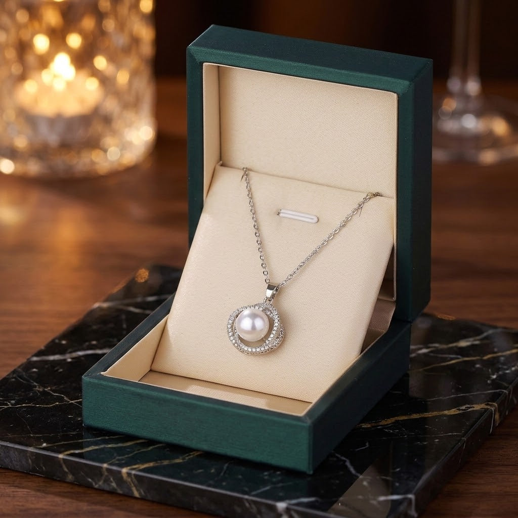 White pearl pendant necklace with rhinestone halo in a gift box
