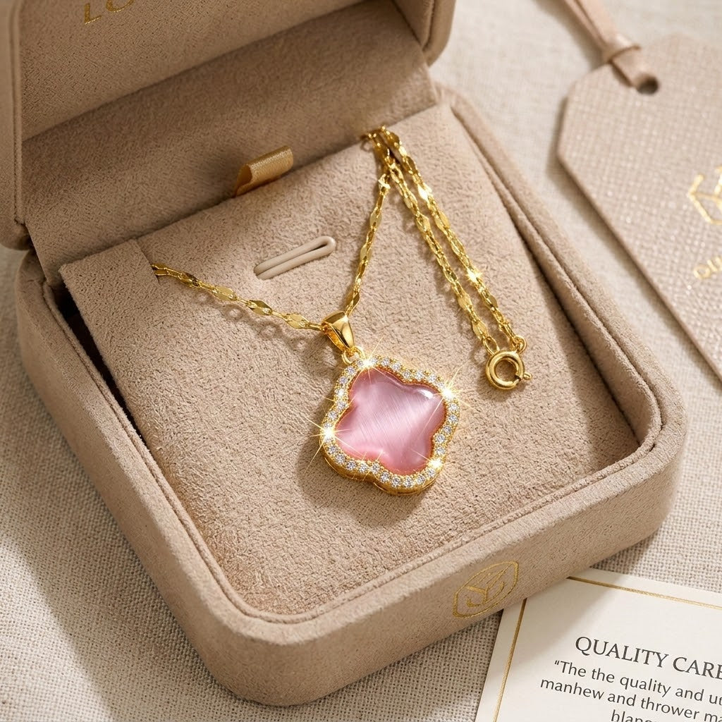 Gold pendant necklace with pink flower-shaped charm and pavé-style edging