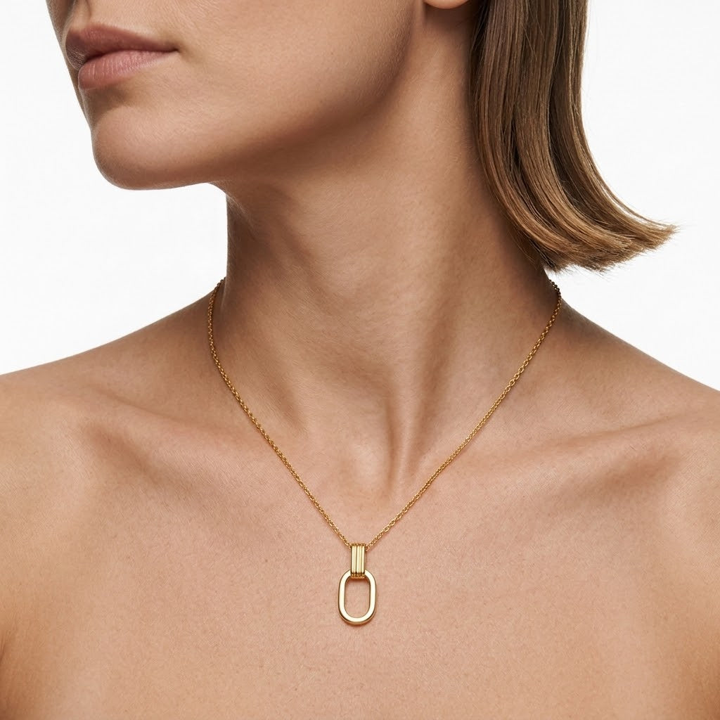 Gold O-shaped charm necklace on model with open oval pendant