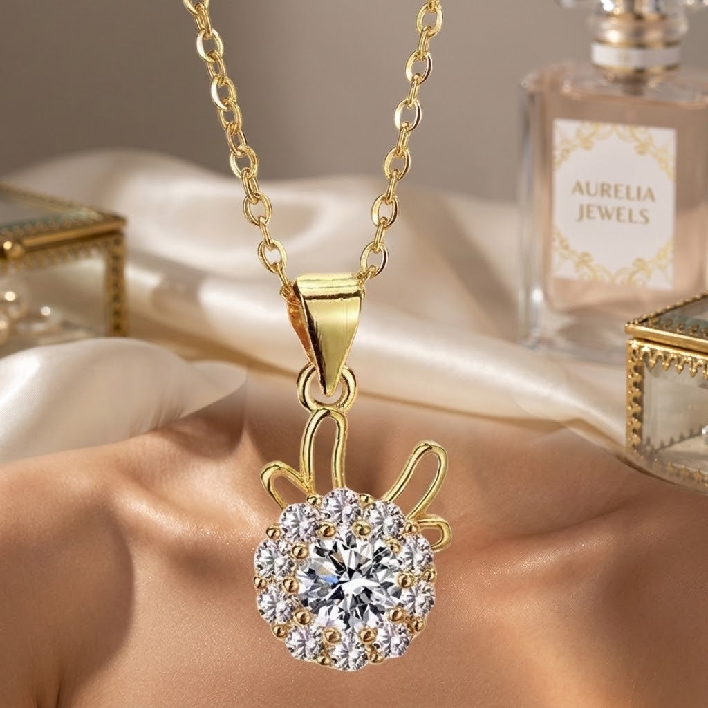 Gold-tone flower pendant necklace on a gold chain with round crystal center cluster