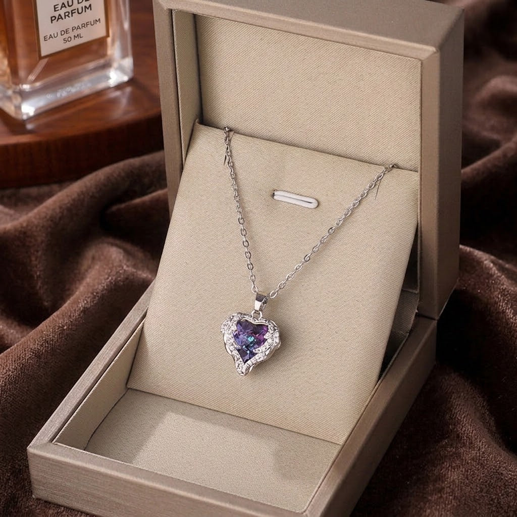 Silver heart pendant necklace with purple gemstone and clear crystal halo