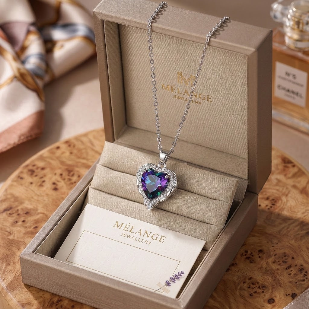 Heart pendant necklace in silver with faceted purple gemstone and adjustable chain